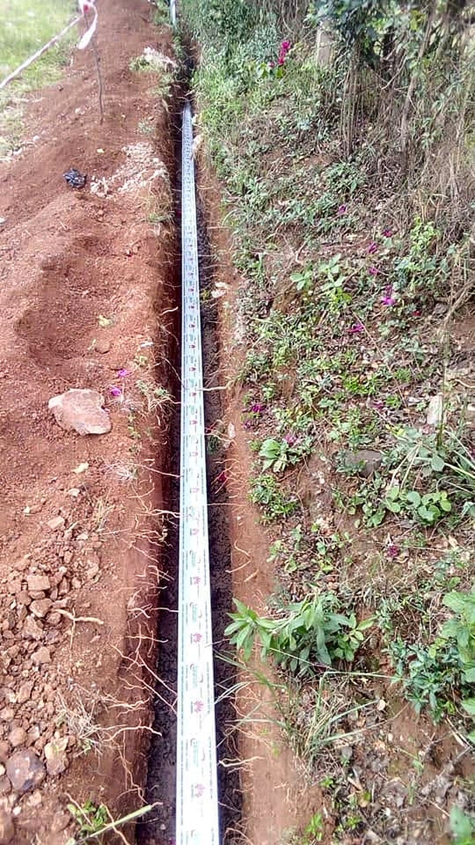 Duct laid in an open trench