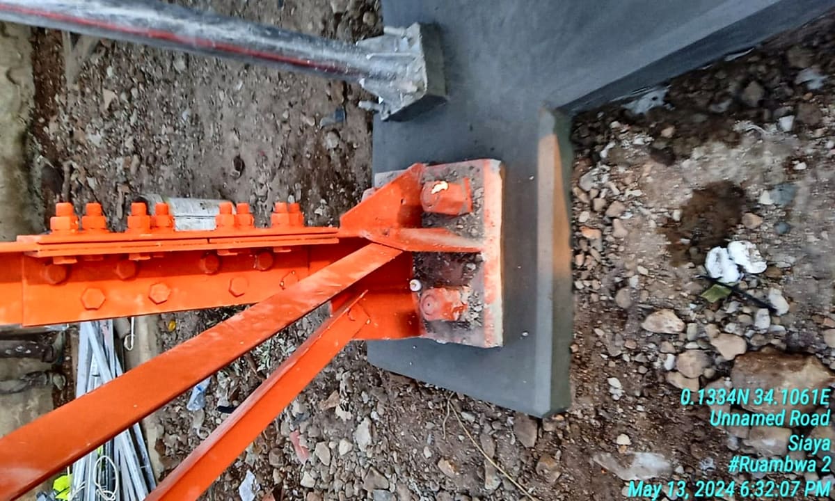 Tower leg set in concrete